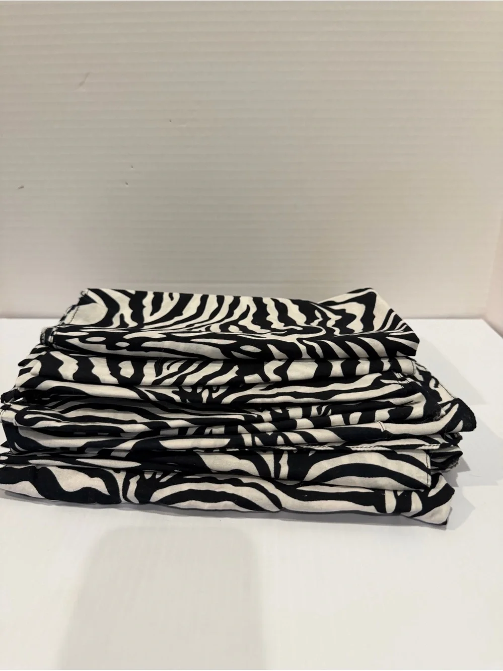 Set of 13 cotton 20x20” Zebra Print Napkins, Black & White, used for a party.